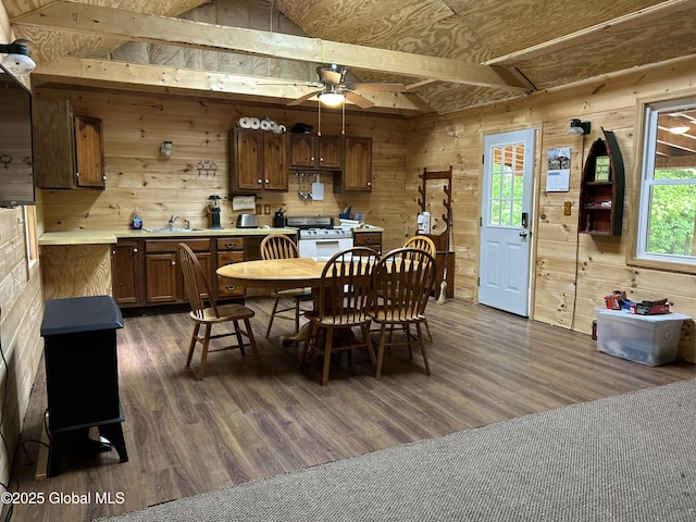 10 W Tucker Rd, Stony Creek, NY 12878 - dining area with dark wood-style flooring, wooden walls, and a ceiling fan