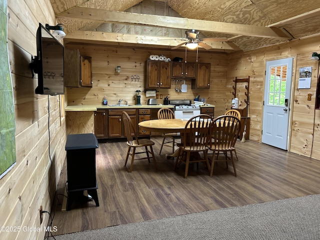10 W Tucker Rd, Stony Creek, NY 12878 - dining area featuring wooden walls, dark wood-style flooring, ceiling fan, and lofted ceiling