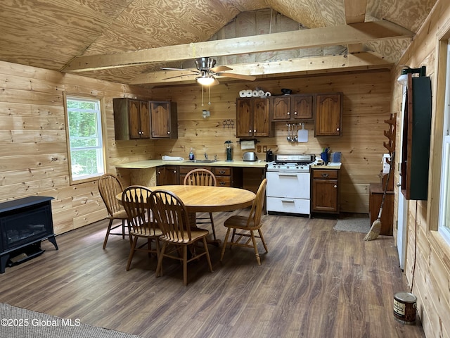 10 W Tucker Rd, Stony Creek, NY 12878 - kitchen featuring white range with gas cooktop, wood walls, dark wood finished floors, light countertops, and vaulted ceiling