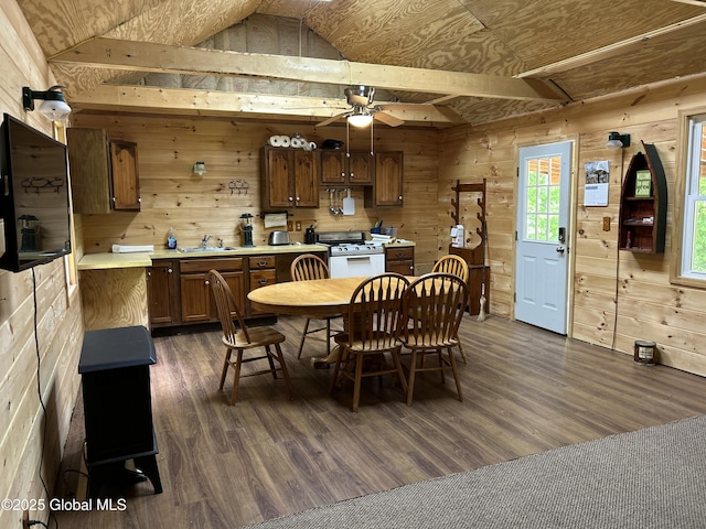 10 W Tucker Rd, Stony Creek, NY 12878 - dining room with wooden walls, dark wood-style floors, lofted ceiling, and a ceiling fan