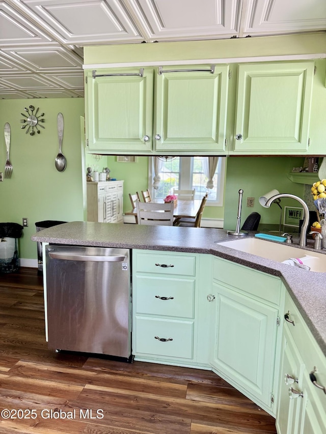 302 Pennsylvania Ave, Johnstown, NY 12095 - kitchen featuring stainless steel dishwasher, a sink, a peninsula, and dark wood-style flooring