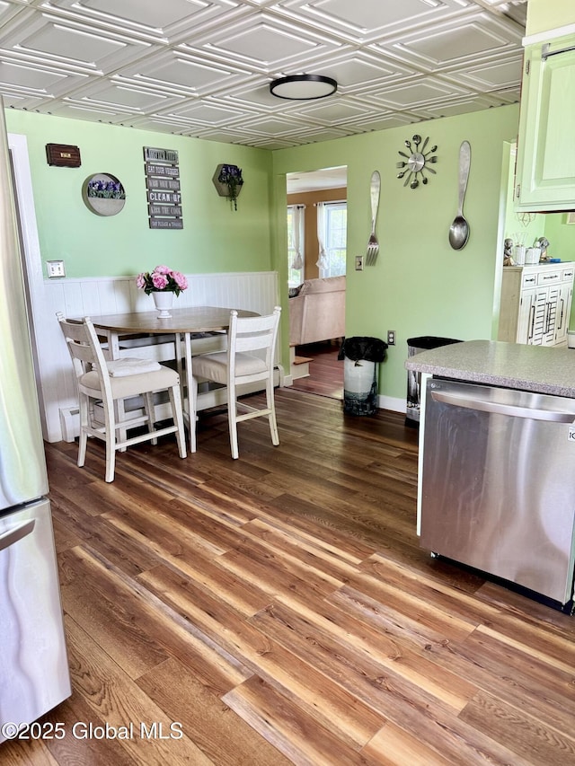 302 Pennsylvania Ave, Johnstown, NY 12095 - dining space with an ornate ceiling, light wood finished floors, and wainscoting