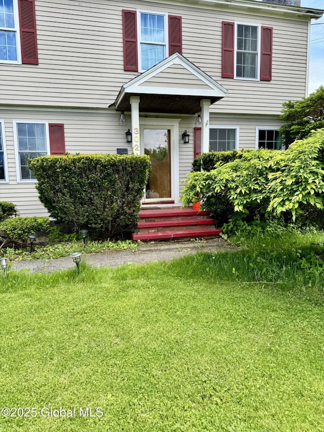 302 Pennsylvania Ave, Johnstown, NY 12095 - view of exterior entry with a yard
