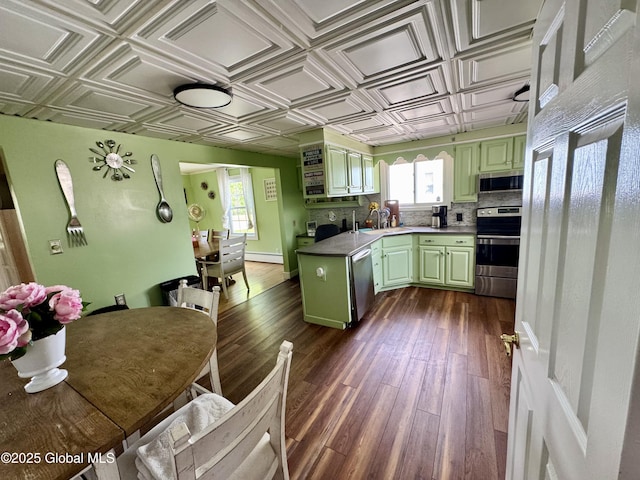 302 Pennsylvania Ave, Johnstown, NY 12095 - kitchen featuring green cabinets, appliances with stainless steel finishes, an ornate ceiling, and plenty of natural light