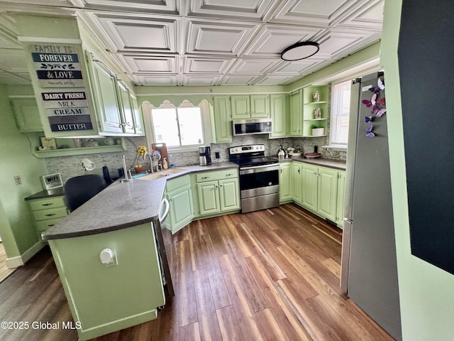 302 Pennsylvania Ave, Johnstown, NY 12095 - kitchen featuring appliances with stainless steel finishes, green cabinets, a sink, healthy amount of natural light, and an ornate ceiling