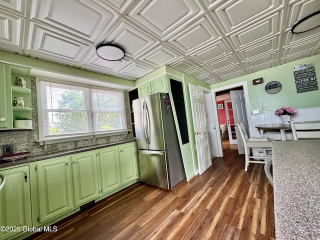 302 Pennsylvania Ave, Johnstown, NY 12095 - kitchen featuring green cabinetry, freestanding refrigerator, an ornate ceiling, dark countertops, and dark wood-style flooring