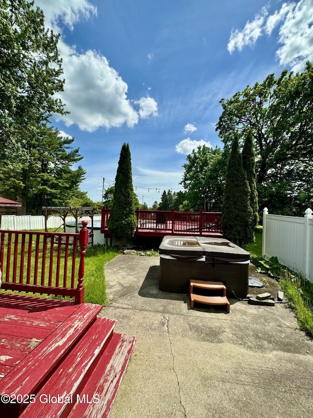 302 Pennsylvania Ave, Johnstown, NY 12095 - wooden deck featuring a hot tub and a patio area