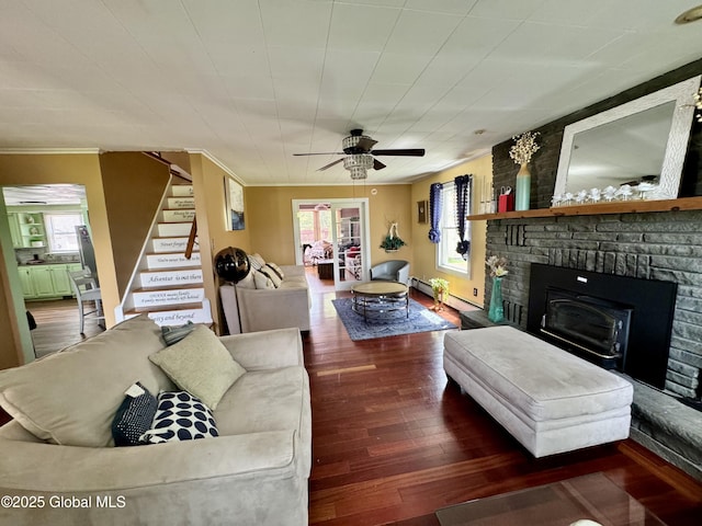 302 Pennsylvania Ave, Johnstown, NY 12095 - living room with wood finished floors, crown molding, stairs, healthy amount of natural light, and ceiling fan