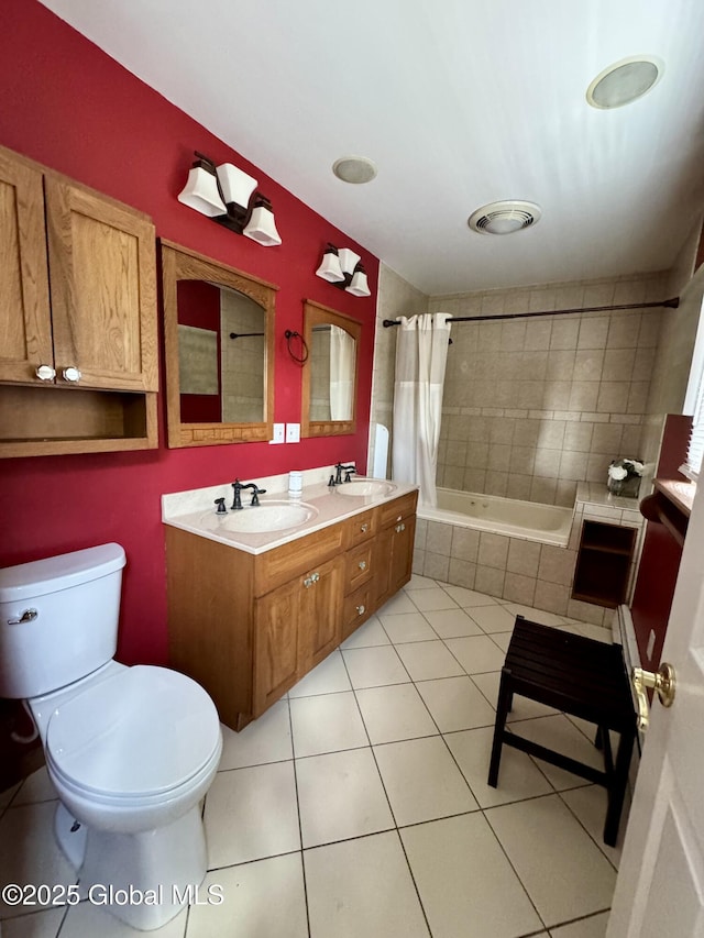 302 Pennsylvania Ave, Johnstown, NY 12095 - bathroom featuring toilet, tile patterned floors, double vanity, and tiled shower / bath combo