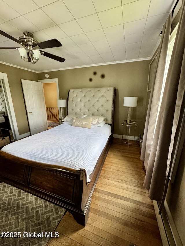 302 Pennsylvania Ave, Johnstown, NY 12095 - bedroom featuring wood-type flooring, crown molding, a ceiling fan, and baseboards
