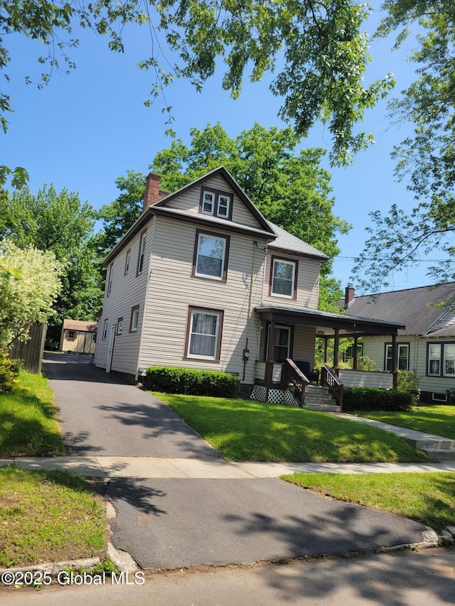 206 Catherine St, Scotia, NY 12302 - view of front of property with a chimney, a porch, and a front lawn