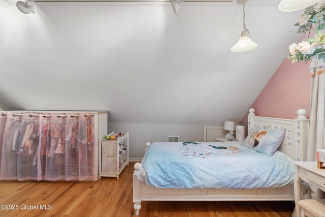 2400 Curry Rd, Schenectady, NY 12303 - bedroom with wood finished floors and lofted ceiling