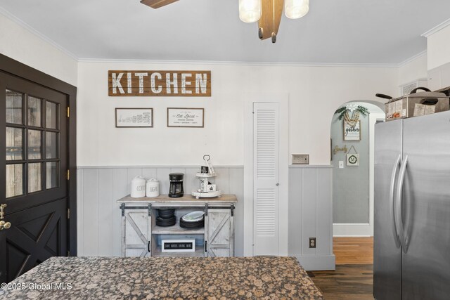 2400 Curry Rd, Schenectady, NY 12303 - kitchen with freestanding refrigerator, ornamental molding, dark wood finished floors, and a wainscoted wall