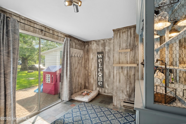 2400 Curry Rd, Schenectady, NY 12303 - entryway with stone finish floors, a baseboard radiator, and wooden walls