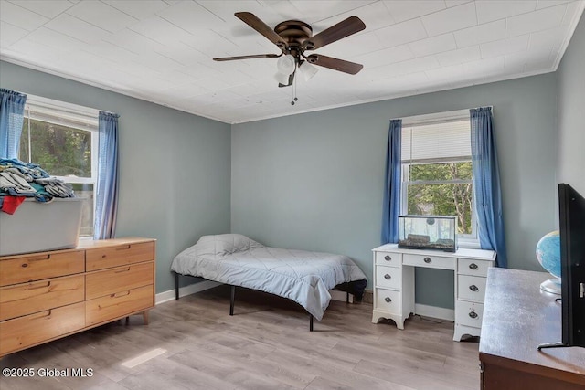3287 Ny Highway 43, Sand Lake, NY 12018 - bedroom with multiple windows, ornamental molding, light wood finished floors, and a ceiling fan