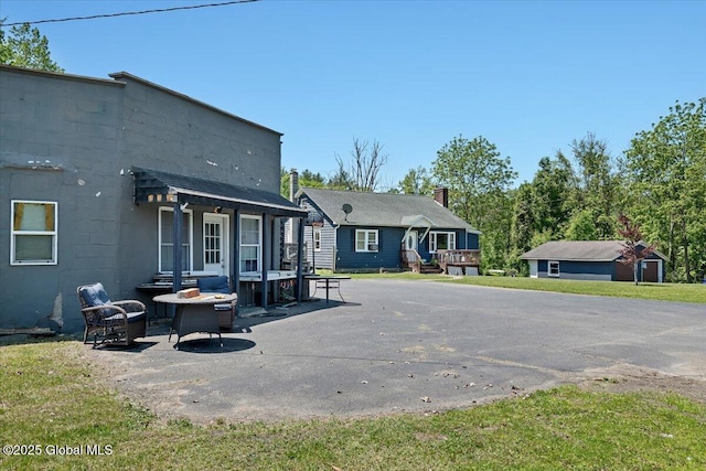 3287 Ny Highway 43, Sand Lake, NY 12018 - rear view of house featuring a patio and a deck