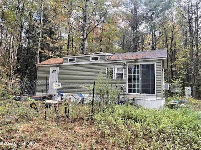 211 Prahl Rd, Galway, NY 12074 - view of front of home with cooling unit and a view of trees