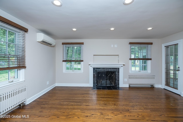 2 Darroch Rd, Bethlehem, NY 12054 - unfurnished living room featuring radiator, an AC wall unit, a tiled fireplace, baseboards, and recessed lighting