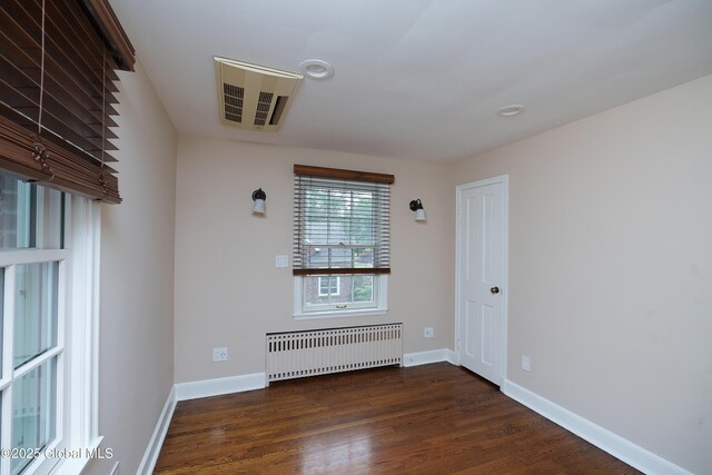 2 Darroch Rd, Bethlehem, NY 12054 - unfurnished room with radiator, wood finished floors, and baseboards