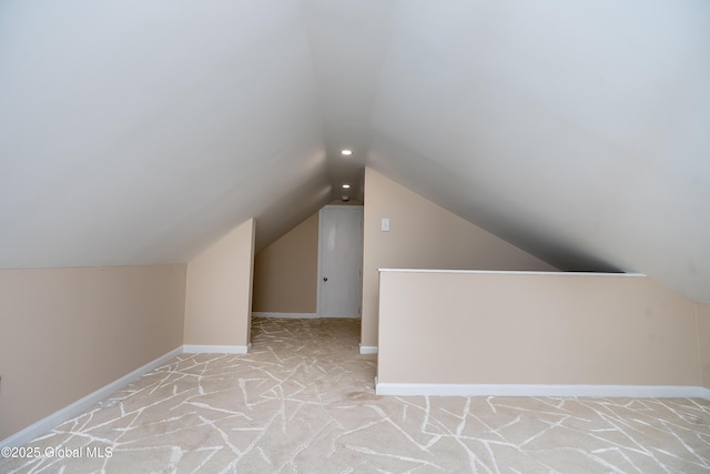 2 Darroch Rd, Bethlehem, NY 12054 - additional living space with vaulted ceiling, light carpet, and baseboards