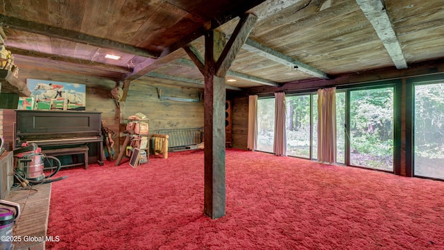 824 County Highway 106, Mayfield, NY 12010 - living area with wooden ceiling with exposed beams, carpet flooring, and wood walls