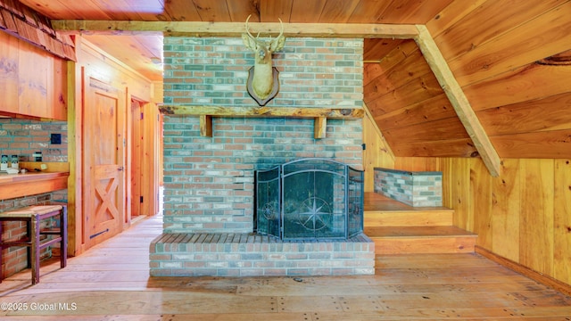 824 County Highway 106, Mayfield, NY 12010 - unfurnished living room featuring wooden ceiling with exposed beams, hardwood / wood-style flooring, and wood walls