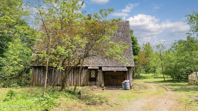 824 County Highway 106, Mayfield, NY 12010 - view of side of home with an outdoor structure and a barn