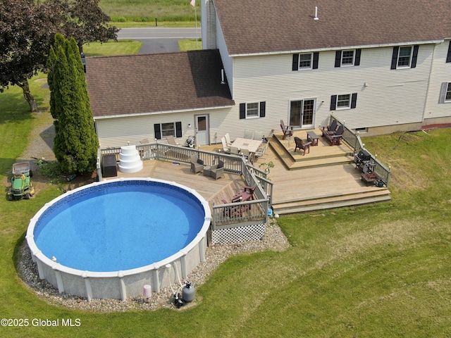 540 Mohawk Dr, Mohawk, NY 12068 - back of property with a wooden deck, a lawn, and a shingled roof