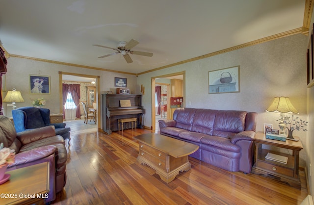 540 Mohawk Dr, Mohawk, NY 12068 - living area with hardwood / wood-style floors, a ceiling fan, crown molding, wallpapered walls, and baseboards