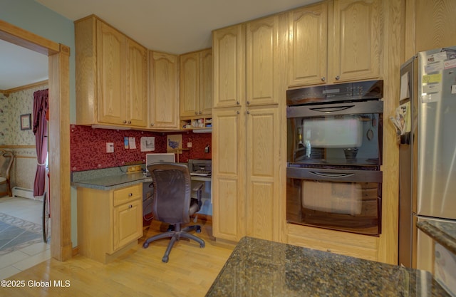 540 Mohawk Dr, Mohawk, NY 12068 - kitchen with wallpapered walls, freestanding refrigerator, dark countertops, light wood-style flooring, and light brown cabinetry