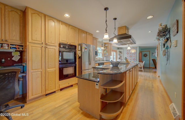 540 Mohawk Dr, Mohawk, NY 12068 - kitchen featuring open shelves, freestanding refrigerator, a kitchen island, light wood-style floors, and dark stone countertops