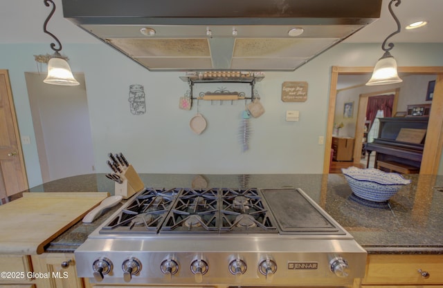 540 Mohawk Dr, Mohawk, NY 12068 - kitchen featuring island range hood, stove, dark stone countertops, and pendant lighting