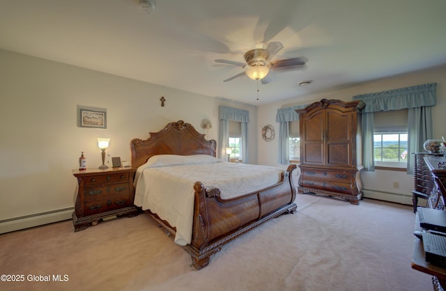 540 Mohawk Dr, Mohawk, NY 12068 - bedroom featuring light carpet, a baseboard heating unit, and ceiling fan