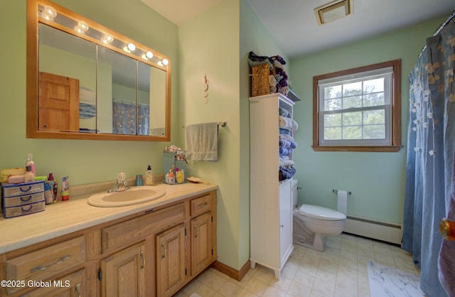 540 Mohawk Dr, Mohawk, NY 12068 - bathroom with a baseboard heating unit, vanity, toilet, baseboards, and curtained shower