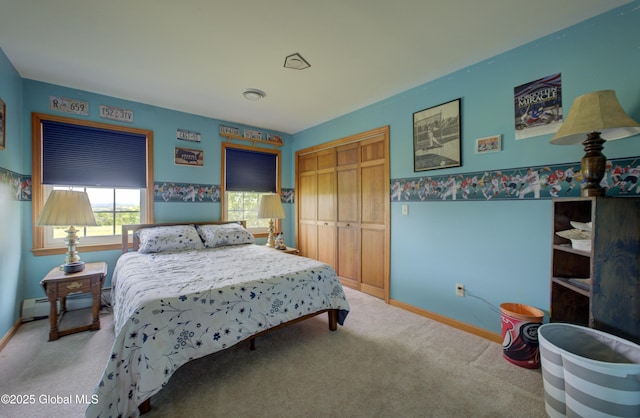 540 Mohawk Dr, Mohawk, NY 12068 - carpeted bedroom featuring baseboards, a closet, and a baseboard radiator
