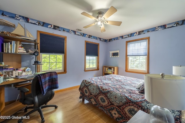 540 Mohawk Dr, Mohawk, NY 12068 - bedroom with multiple windows, wood finished floors, baseboards, and a desk