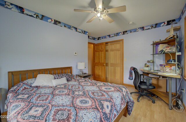 540 Mohawk Dr, Mohawk, NY 12068 - bedroom with a closet, wood finished floors, a ceiling fan, and an office area