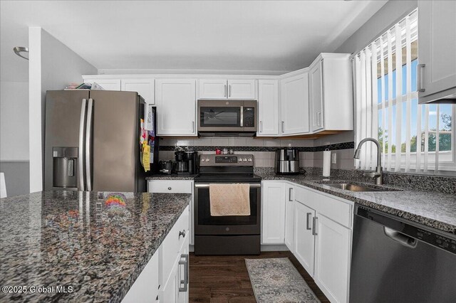 1155 Coplon Ave, Schenectady, NY 12309 - kitchen featuring appliances with stainless steel finishes, a sink, white cabinets, and dark wood-type flooring