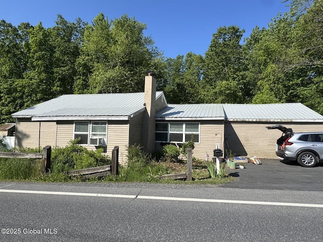 351 Gansevoort Rd, Moreau, NY 12828 - single story home featuring a chimney and metal roof