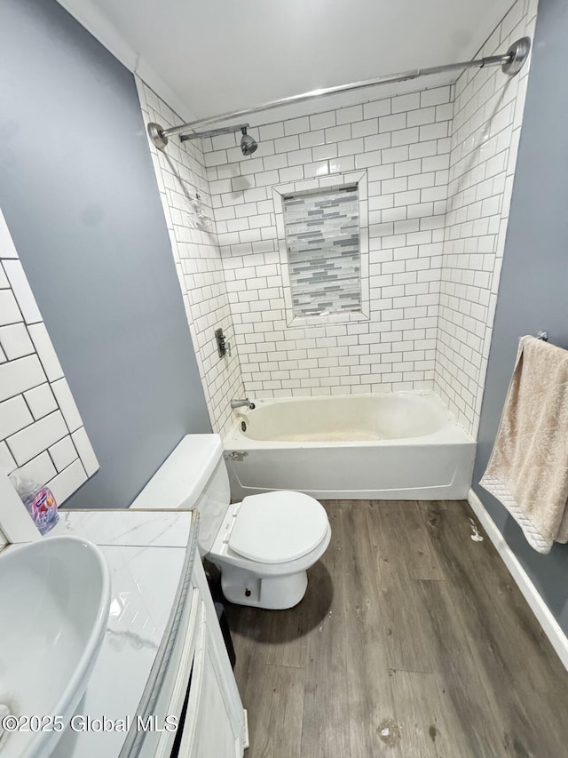 351 Gansevoort Rd, Moreau, NY 12828 - full bathroom featuring wood finished floors, vanity, toilet, and shower / tub combination