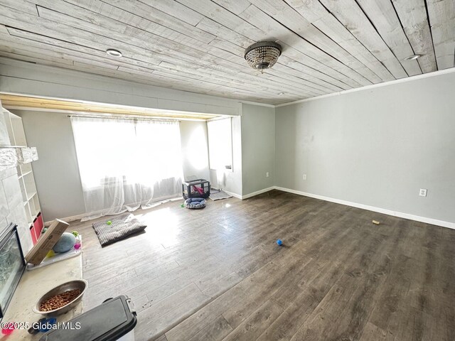 351 Gansevoort Rd, Moreau, NY 12828 - unfurnished living room featuring wood finished floors, crown molding, wooden ceiling, a glass covered fireplace, and baseboards