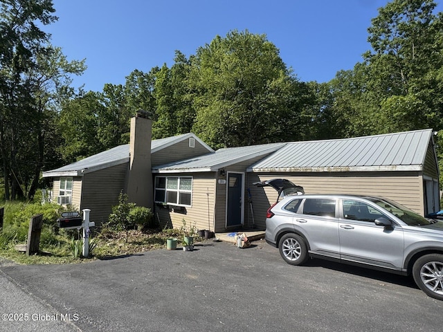 351 Gansevoort Rd, Moreau, NY 12828 - view of front of property with a chimney, metal roof, and cooling unit