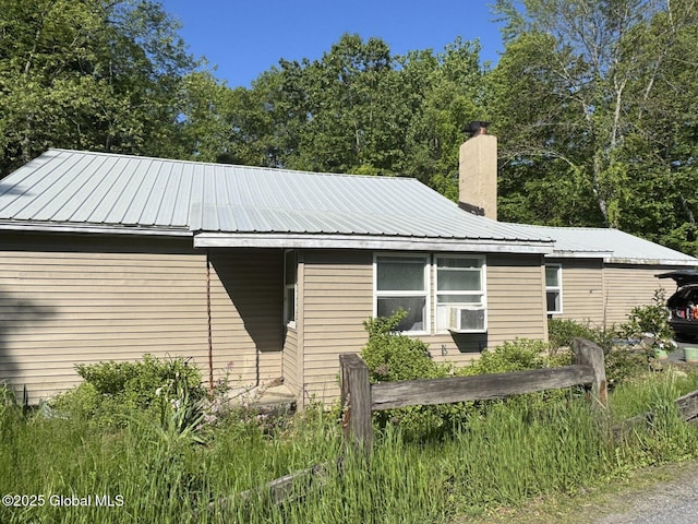 351 Gansevoort Rd, Moreau, NY 12828 - view of front of home featuring a chimney, metal roof, and cooling unit