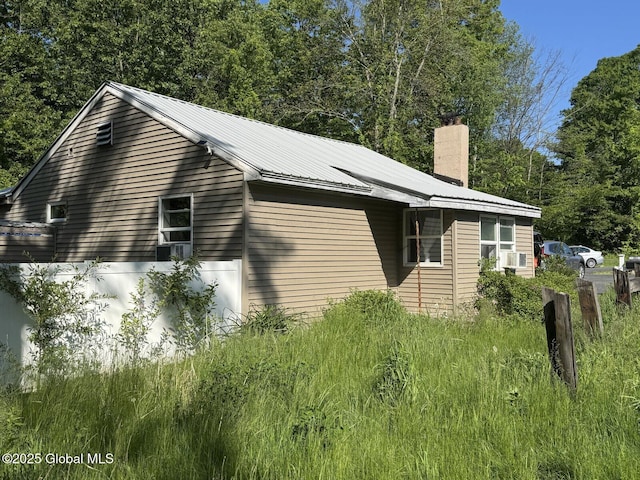 351 Gansevoort Rd, Moreau, NY 12828 - view of home's exterior featuring a chimney and cooling unit