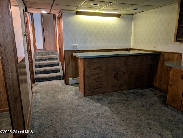 2714 Magnolia St, Endicott, NY 13760 - indoor dry bar featuring a baseboard radiator, dark carpet, wallpapered walls, a paneled ceiling, and stairway