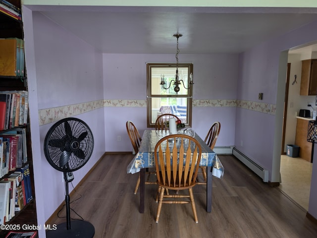2714 Magnolia St, Endicott, NY 13760 - dining room featuring wood finished floors, a chandelier, a baseboard radiator, and wainscoting