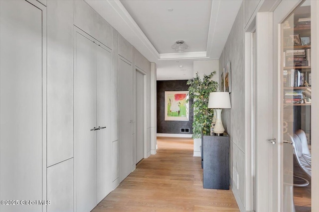 268 Broadway Unit 607, Saratoga Springs, Inside, NY 12866 - corridor featuring light wood-type flooring and a raised ceiling