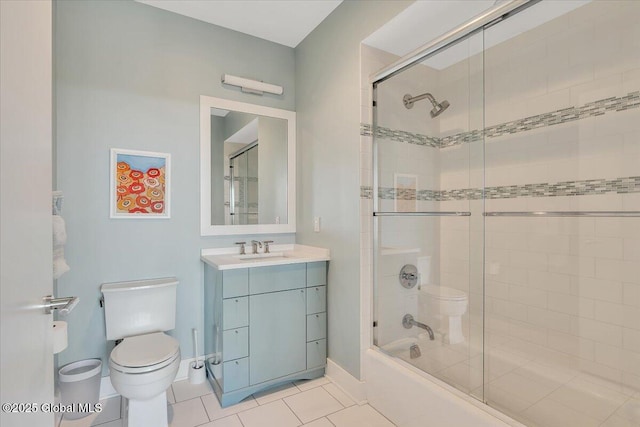 268 Broadway Unit 607, Saratoga Springs, Inside, NY 12866 - full bath featuring toilet, vanity, tile patterned floors, bath / shower combo with glass door, and baseboards