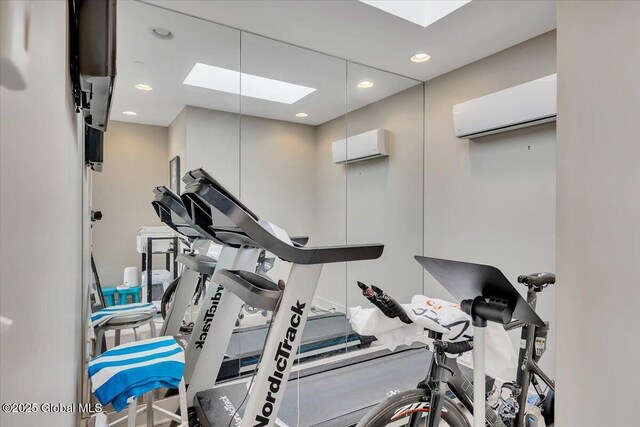 268 Broadway Unit 607, Saratoga Springs, Inside, NY 12866 - workout area featuring a skylight, an AC wall unit, and recessed lighting