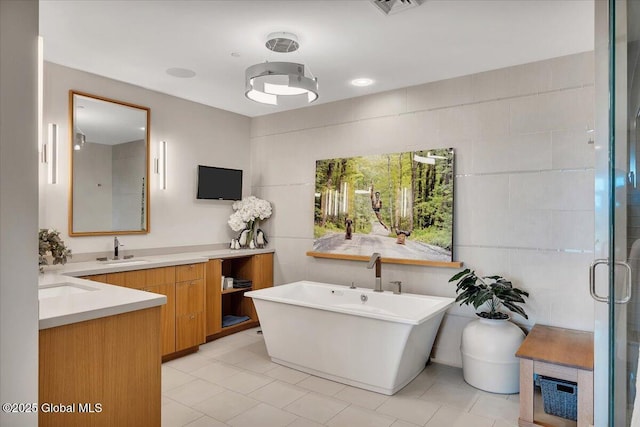 268 Broadway Unit 607, Saratoga Springs, Inside, NY 12866 - full bathroom featuring vanity, a freestanding bath, tile patterned flooring, and a shower stall
